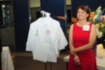 Karlene French poses infront of children's labcoats.